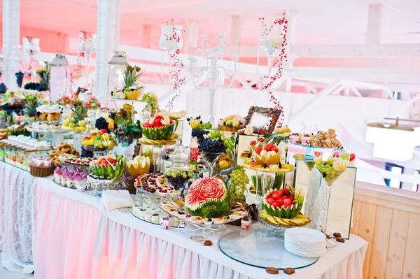 Wedding reception. Table with fruits and sweets