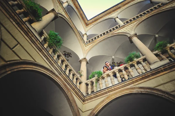 Wedding couple on italian courtyard