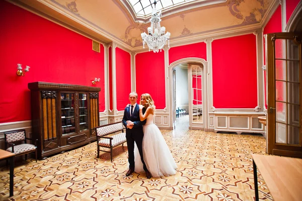 Elegant wedding couple at old vintage house and palace at red ro