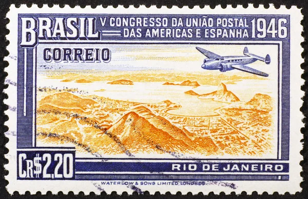 Vintage stamp with plane flying over Rio