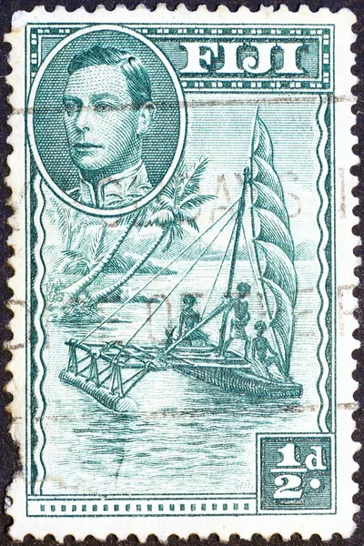 Old sailboat on vintage stamp o Fiji islands