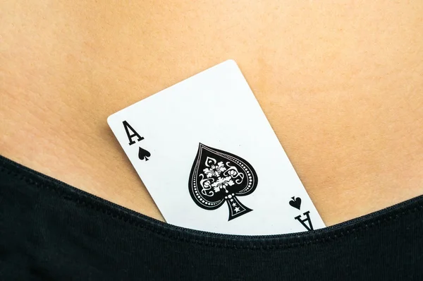 Female sexy body with spades ace card in panties
