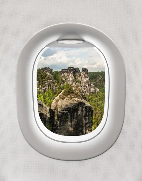 Looking out the window of a plane to the rocks, Germany