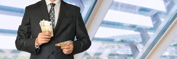 Man in business suit with money