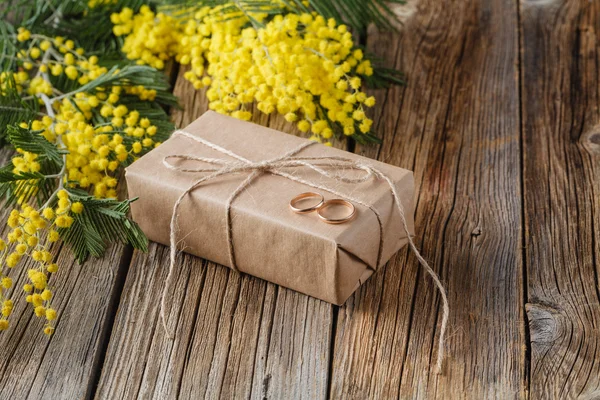 Gift wrapped in craft paper with yellow spring flower