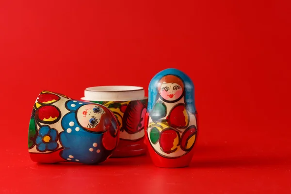 Russian traditional matreshka on red background