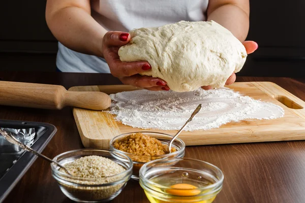 Woman preparing a dough ball