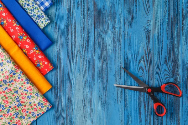 Sewing items on blue table