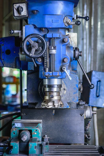Detail of Milling machine in factory workshop.