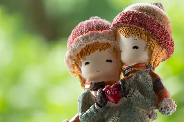 Two Dolls Winter Suit hug and holding Love Heart