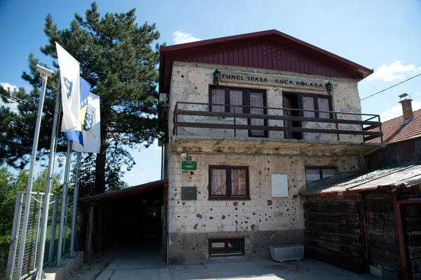 Sarajevo, Bosnia - July 7, 2016: The house through which Sarajevo Tunnel connected the city with other parts during the Siege of Sarajevo constructed in 1993. Note the bullet holes on walls.