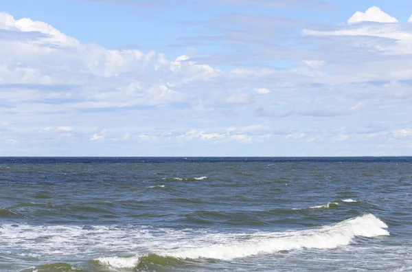 Sea under blue summer sky