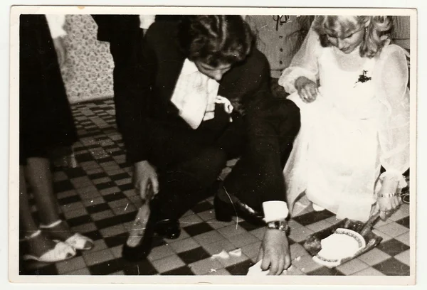 Retro photo shows people on wedding celebration. Black & white vintage photography.