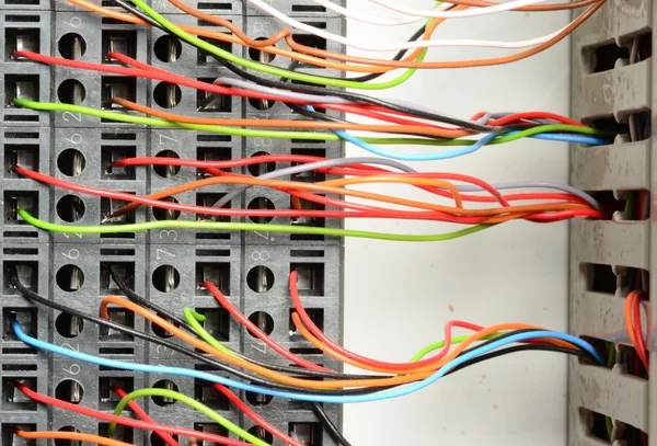 Closeup of electrical distribution board. Connection of color wires.