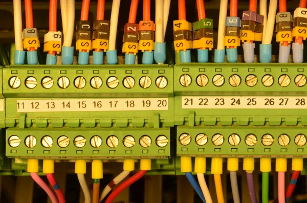 Close up wiring connectors (terminal blocks), multi color wire cables with caption fields.