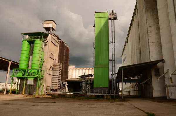 Corn dryer and metal silos. Grain silos - concrete structures for agriculture, wheat, maize, grain etc.