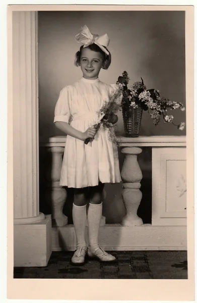 A vintage photo of the young girl - the first holy communion.