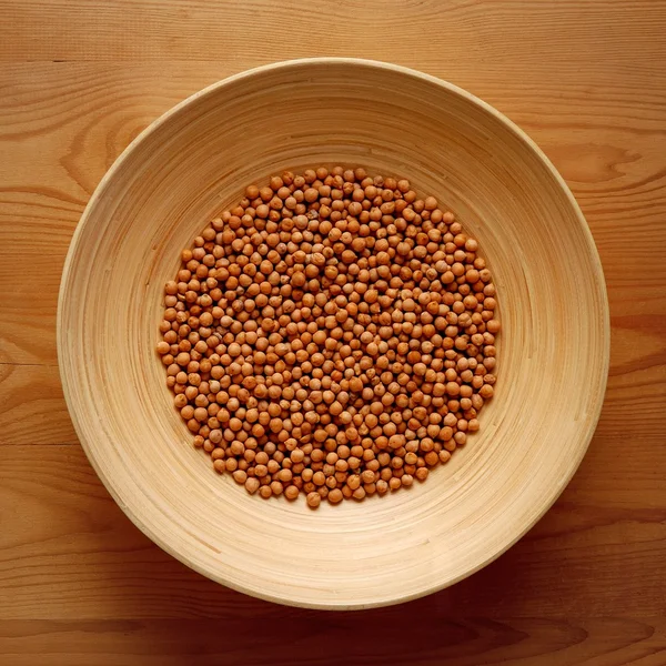 Bamboo Bowl with Chickpeas on Wood Background