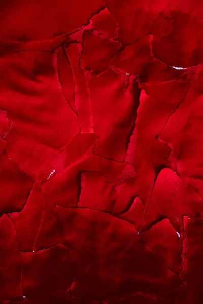 Close up of lots of pieces of torn red paper