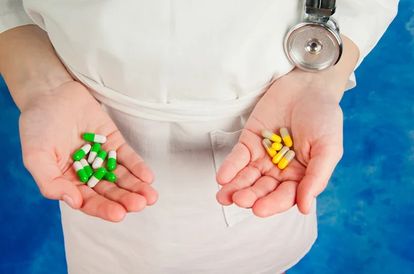 Pharmaceutical colorful capsules in doctor\'s hands