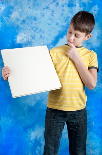 Cute boy posing with a white board