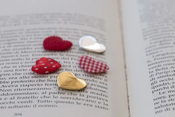 Cloth hearts on opened book