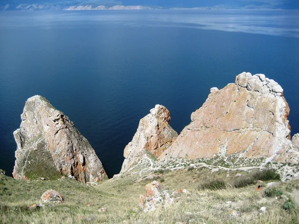 View of lake Baikal from Olkhon island.Cape Sagan-Khushun (White Cape, the rock Three brothers)