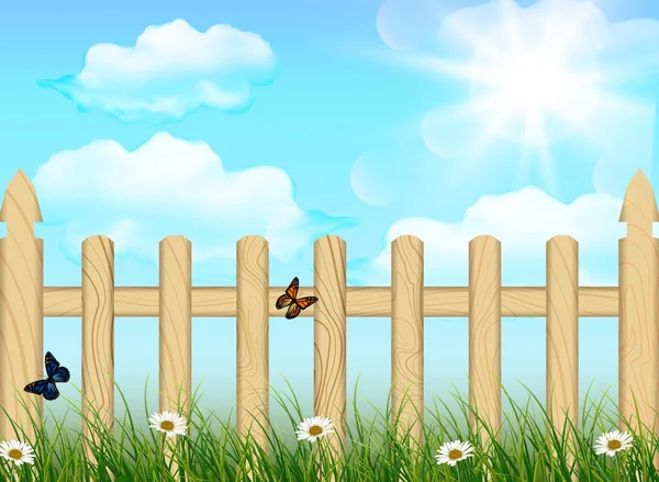 Spring background, grass and wooden fence