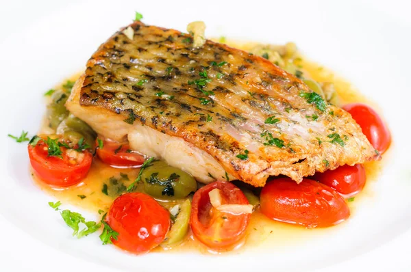Fried fish with roasted cherry tomatoes