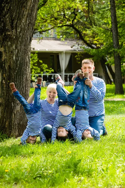 Happy family in the park on a sunny summer day