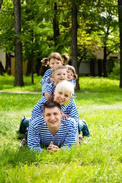 Happy family in the park on a sunny summer day