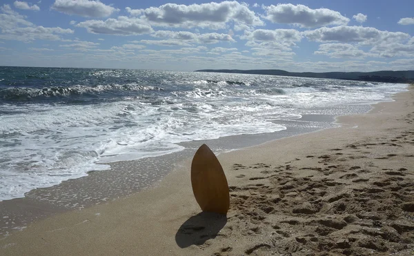 Surf board in the sand