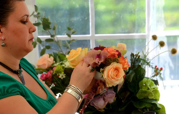 People finishing beautiful and rich bouquet on the competition for florists in Sofia, Bulgaria Aprl 30, 2013