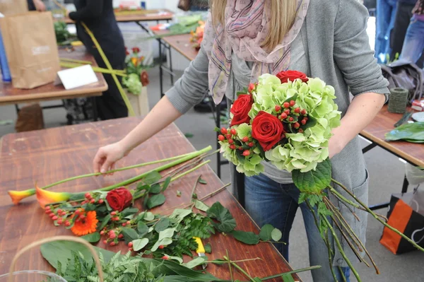 People finishing beautiful and rich bouquet on the competition for florists in Sofia, Bulgaria Aprl 30, 2013