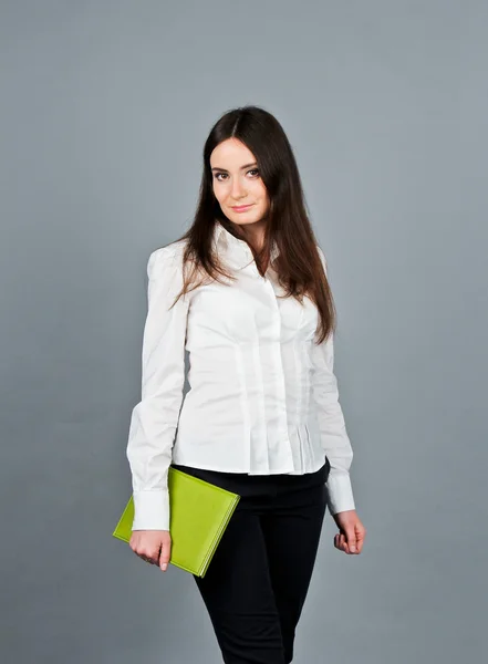 Woman in white blouse standing and keep her green notes