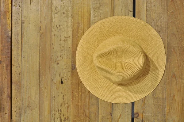 Brown straw hat on a table