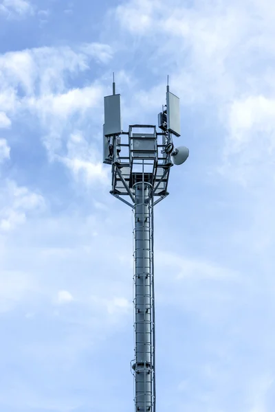 Cellular tower on the blue sky background