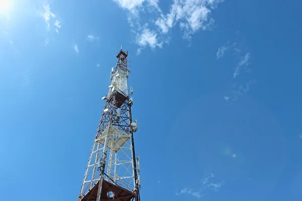 Cellular tower on the blue sky background