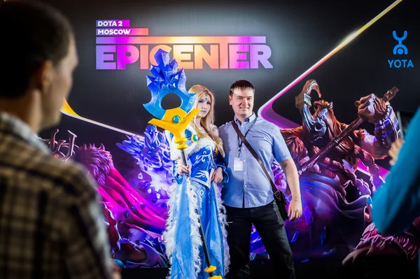 EPICENTER MOSCOW Dota 2 cybersport event may 13. Cosplay of game heroes crystal maiden and juggernaut at the event background making photo with visitor