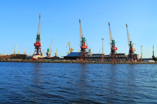 Gantry cranes on the shore of the river