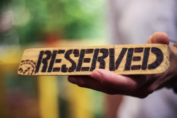 Reserved sign on a bokeh background