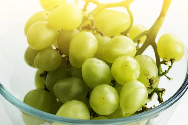 White grape in a glass bowl. bunch of grapes in a glass bowl