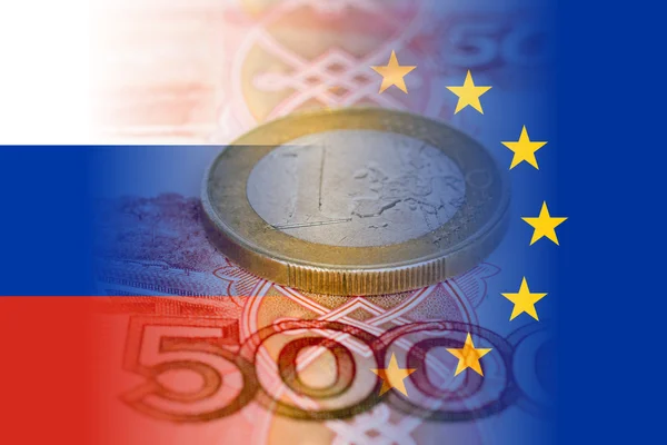 Russia and eu flags with ruble banknotes and euro coin