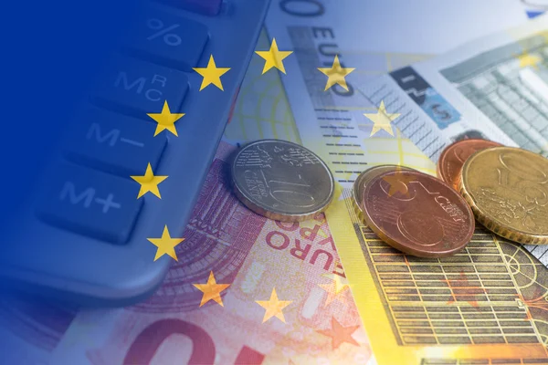 Euro banknotes, coins, calculator, eu flag