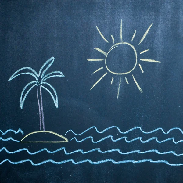 Sun, sea and island drawing on black chalkboard