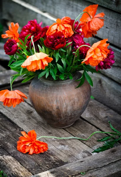 Bouquet of peonies and poppies