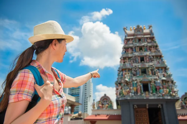 Happy Asia woman Travel in Singapore, Sri Mariamman Temple