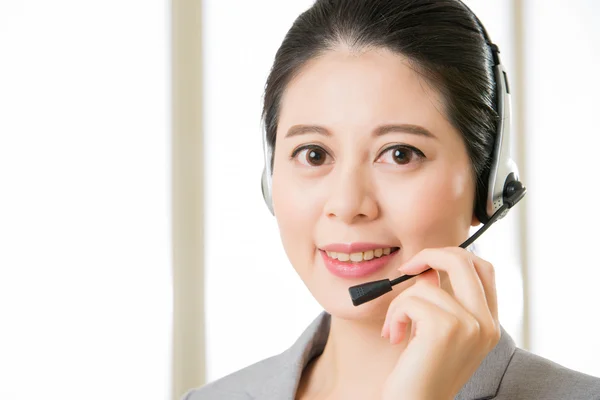 Beautiful asian business customer service woman smiling