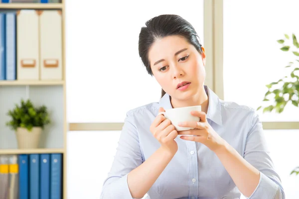 Young asian business woman overworked with uncomfortable