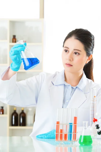 Smart asian female chemist use knowledge power to find the cure